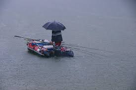 pesca-chuva-barco Pescaria em dia de chuva